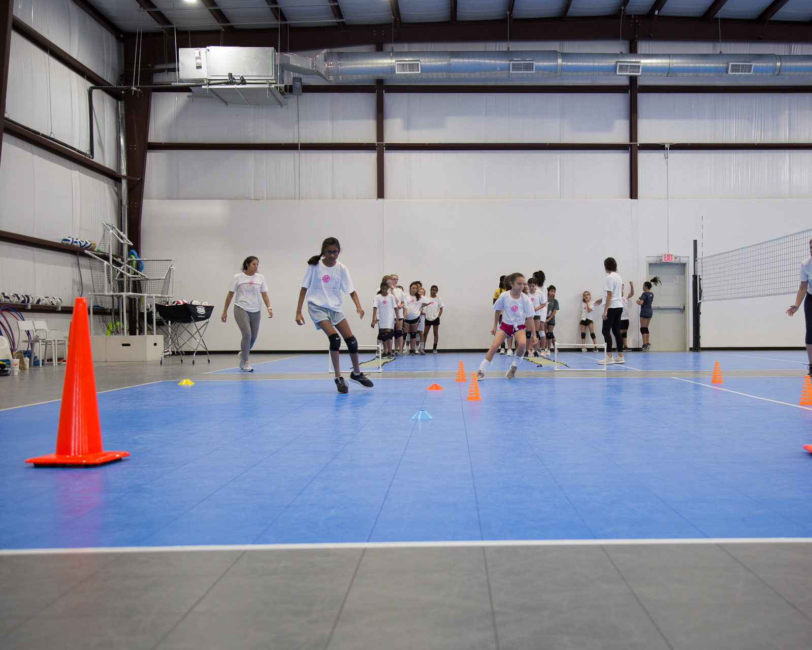 group-of-girls-running-doing-volleyball-drills